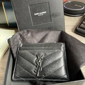 Used YSL black leather wallet. Great condition small mark on the tip of the Y.